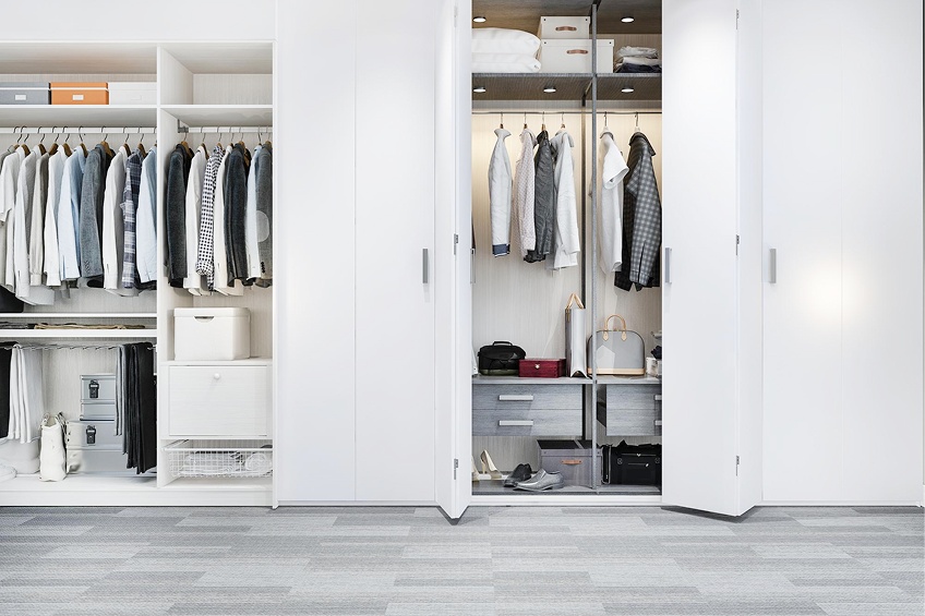 Bedroom wardrobe with loft storage and mirror